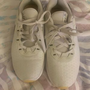 Beige and leopard Nikes.